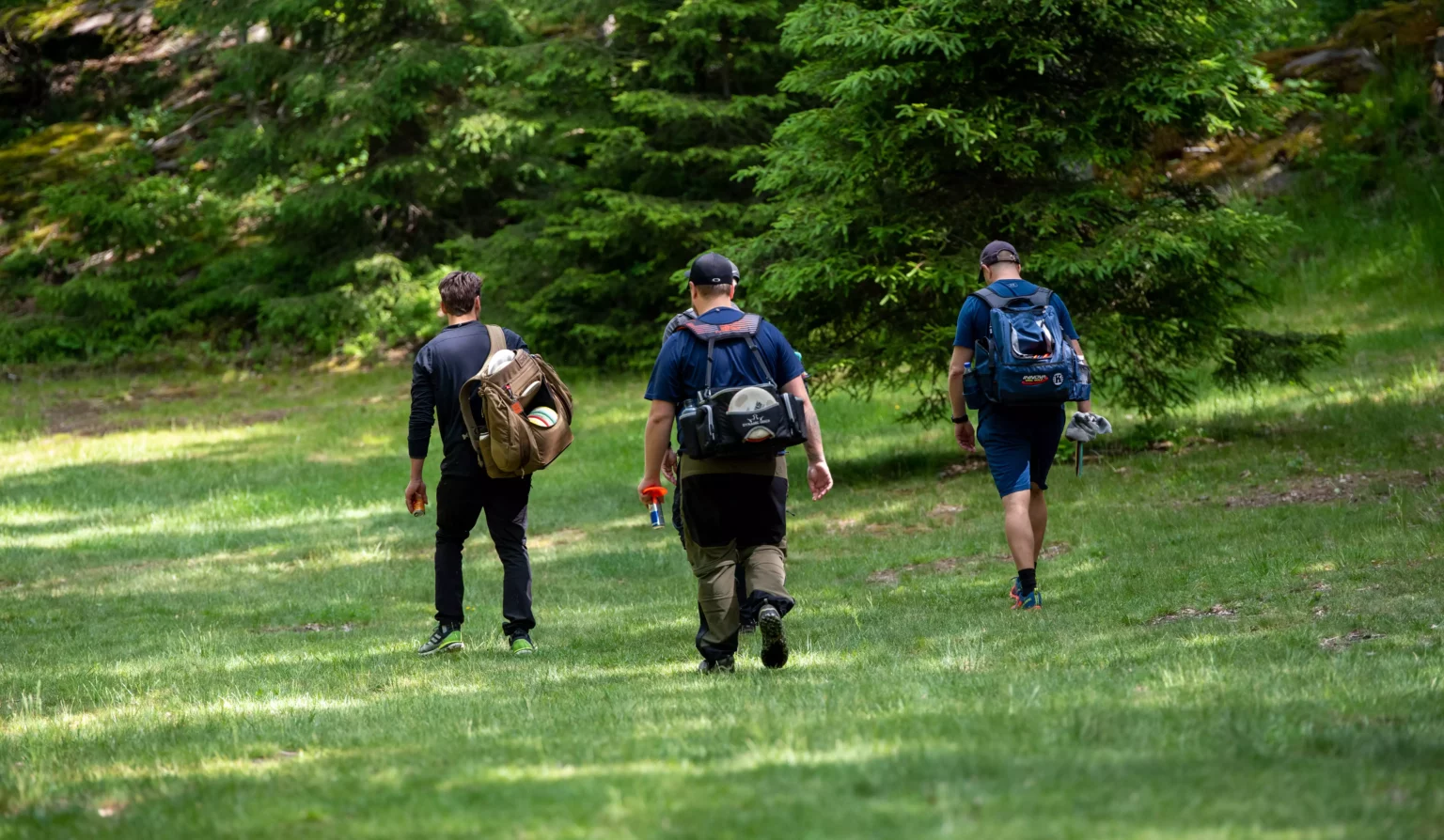 Disc golfers walking on the course at Ale Disc Golf Center